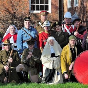 A press shot of living history reenactors in The Commandery gardens.