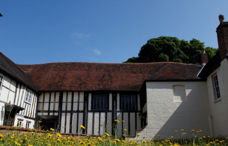 A photo of The Commandery's black-and-white timber exterior on a summer's day.