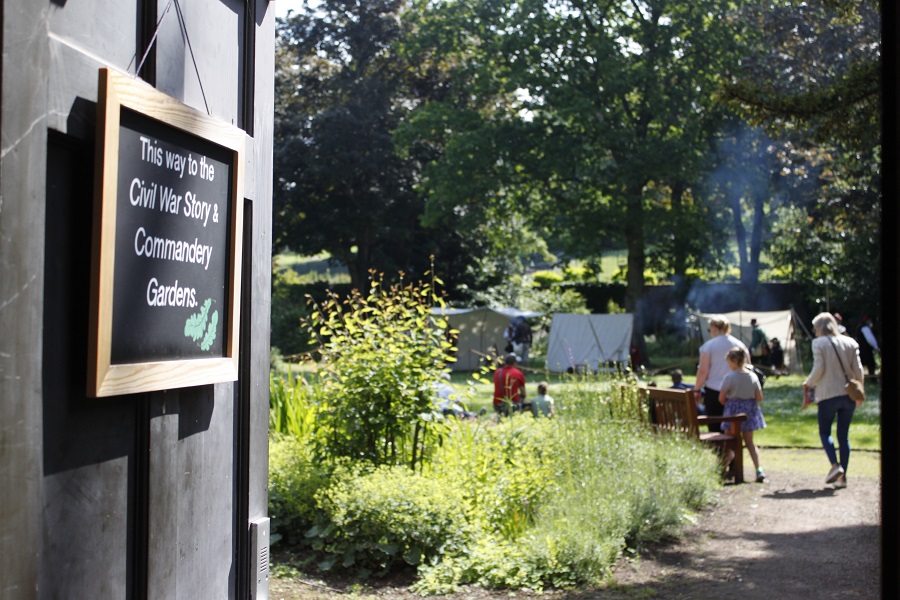 A photo looking out at The Commandery's garden while an event is taking place - there are lots of things to do.