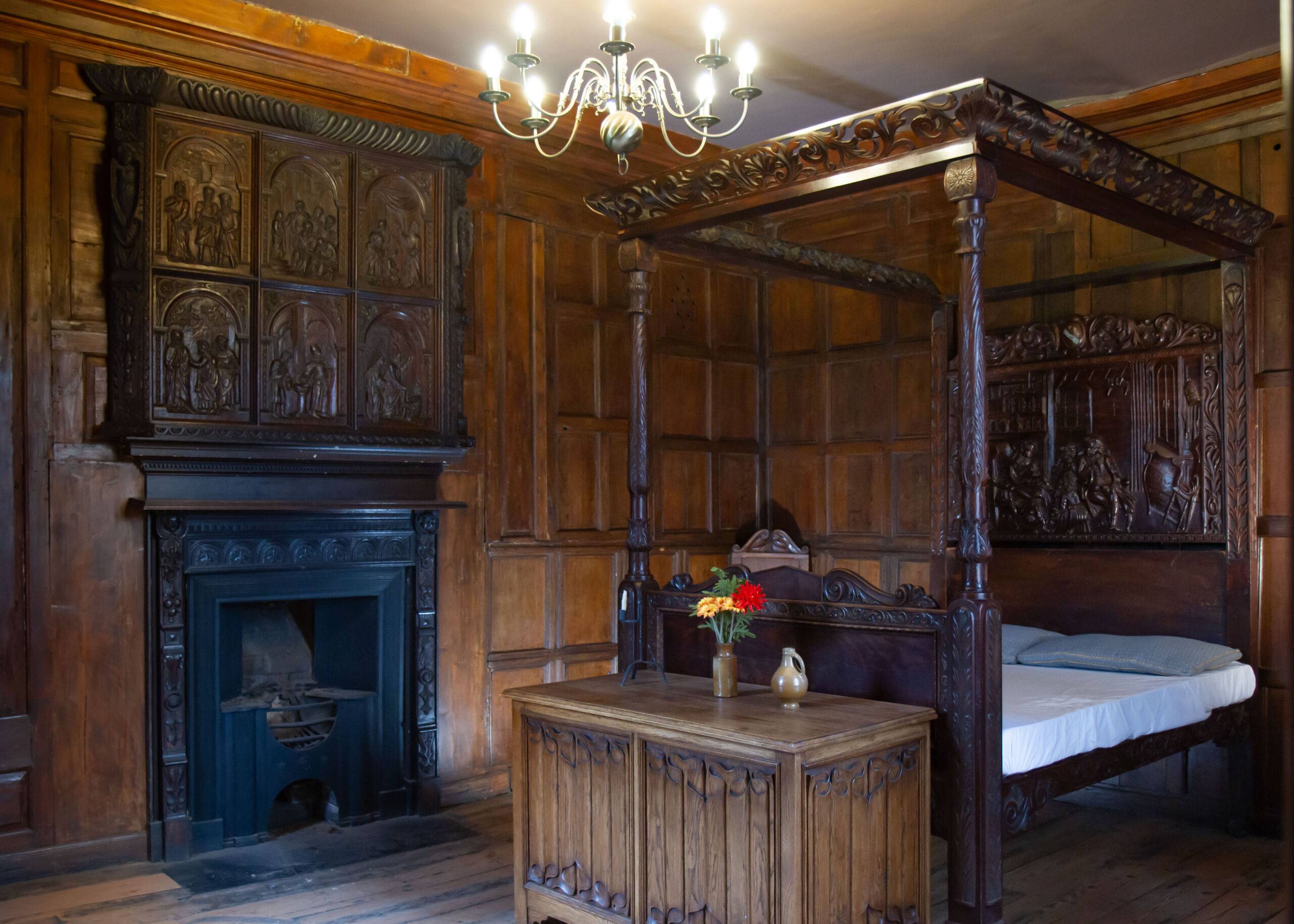 A photo of a wood-panelled bedroom in the Tudor rooms at The Commandery.