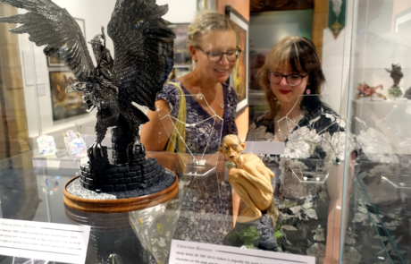 A photo showing visitors in The Magic of Middle Earth exhibition at Worcester City Art Gallery and Museum.