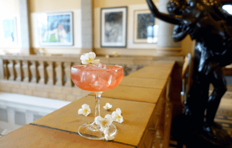 A photo showing a cocktail for Museum After Hours by the balcony cafe at Worcester City Art Gallery and Museum.
