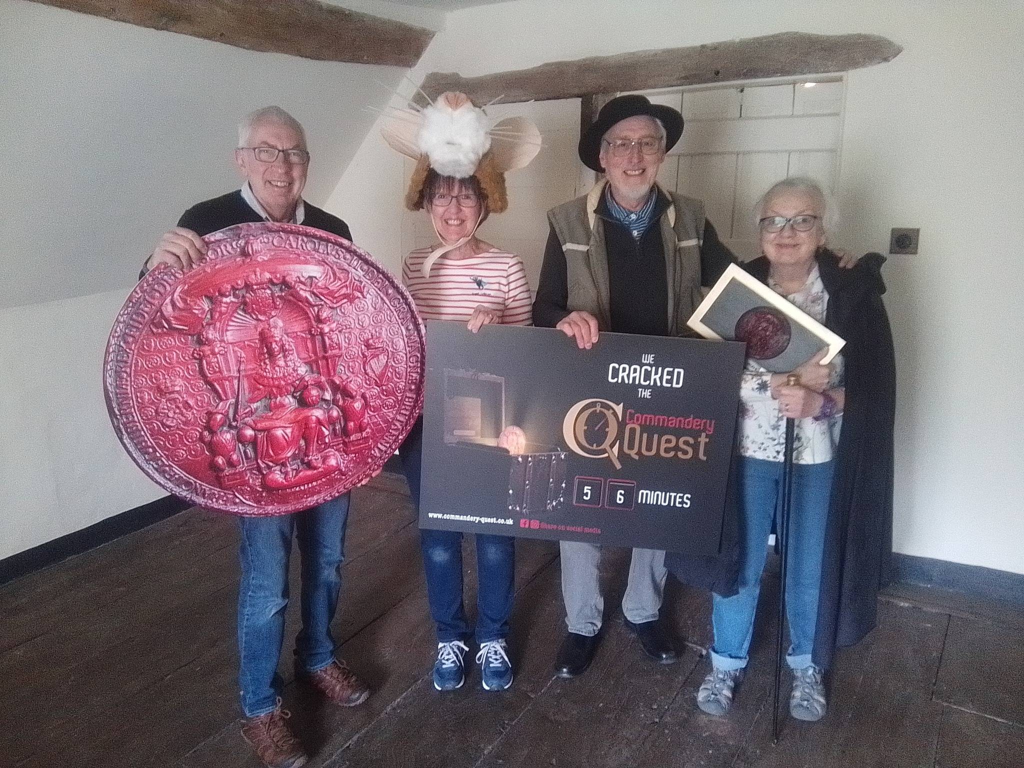 A group of people posing after completing Commandery Quest.