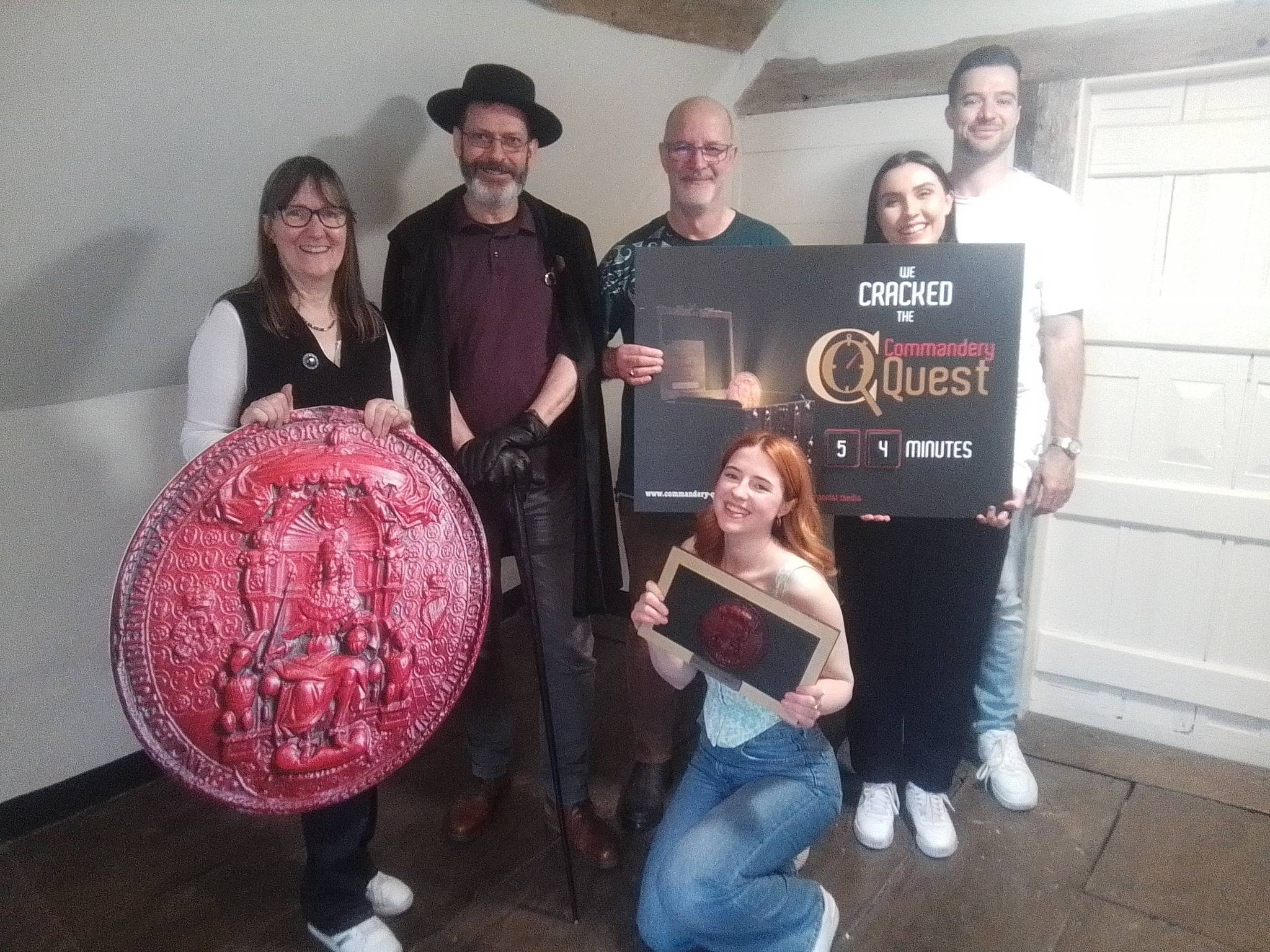 A group of people posing after completing Commandery Quest.