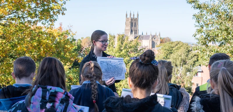 A photo showing a school session taking place at the top of Fort Royal Hill.