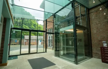 A photo showing the interior entrance to the County Museum, including the glass lift.